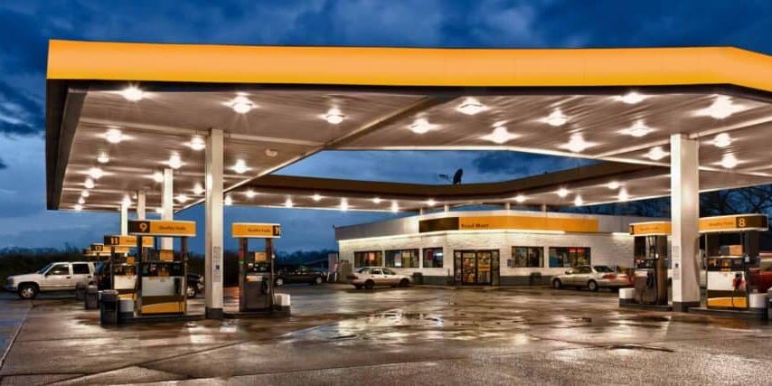 An HDR image of a generic gas station and convenience store at dusk immediately after a big rain.