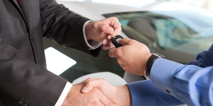 Car Key Car salesperson delivering a key to a customer